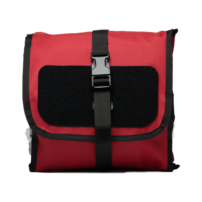 WHACK Pro first aid kit is medic preferred and shown closed in the red quad fold utility bag.